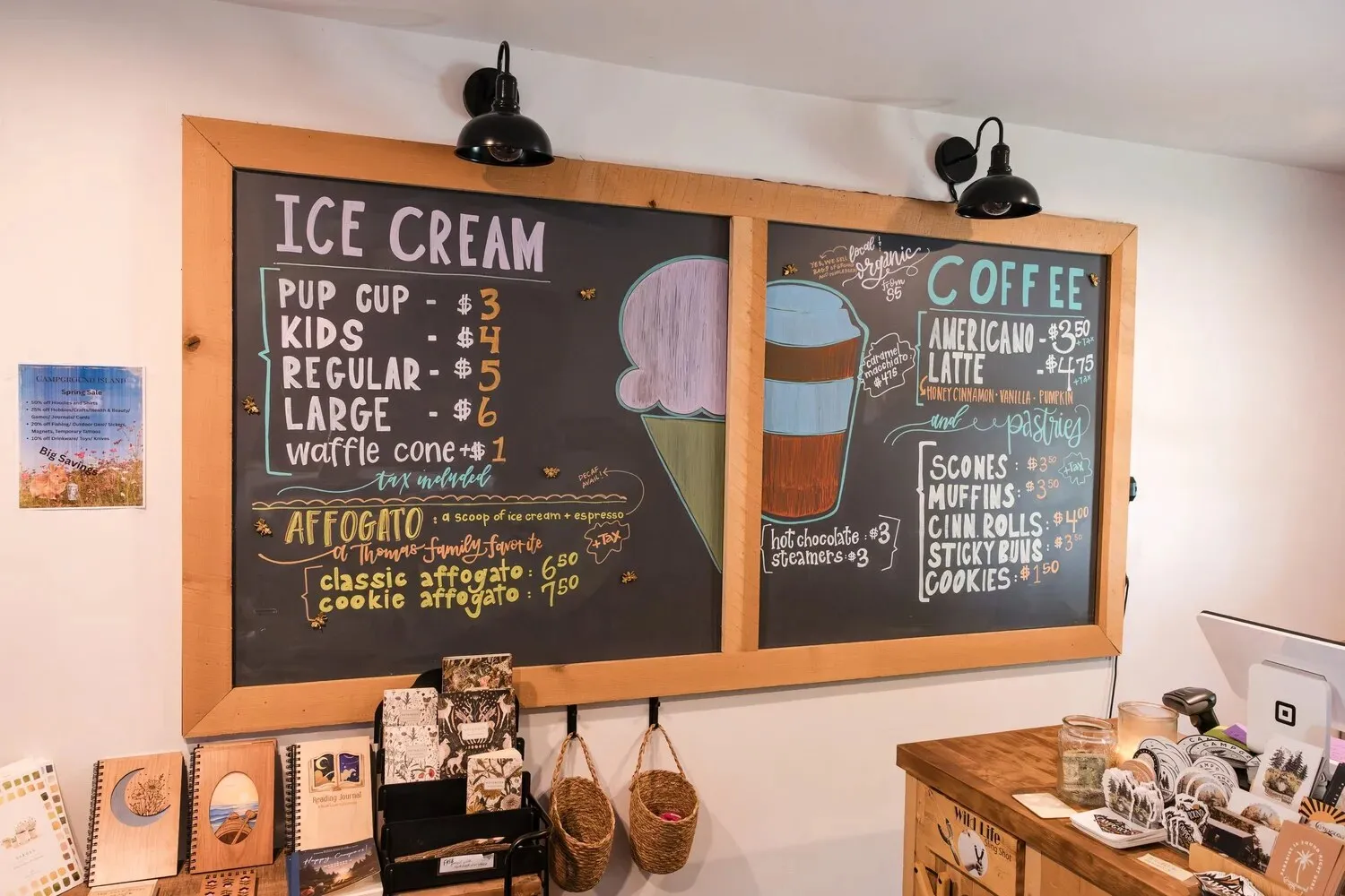 Chalkboard menus for ice cream and coffee above the camp store counter