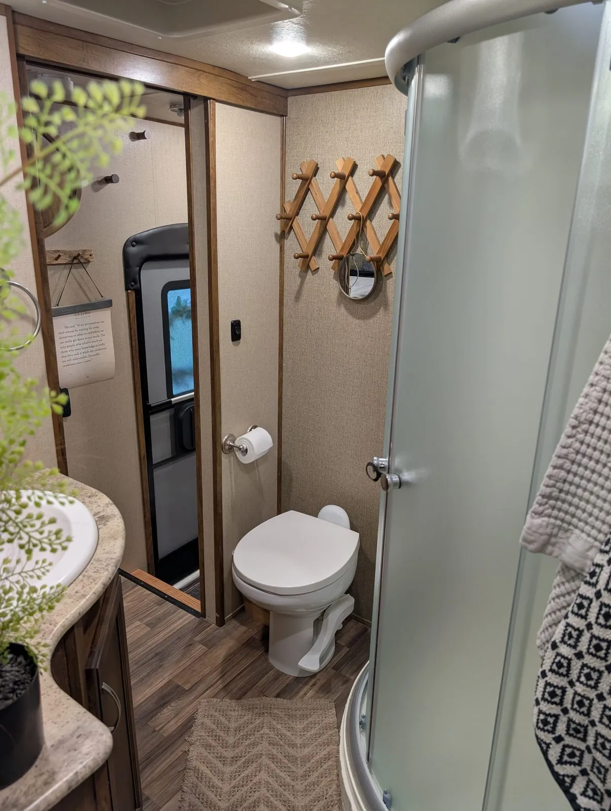 Inside the rental camper: the bathroom with a corner shower and a toilet