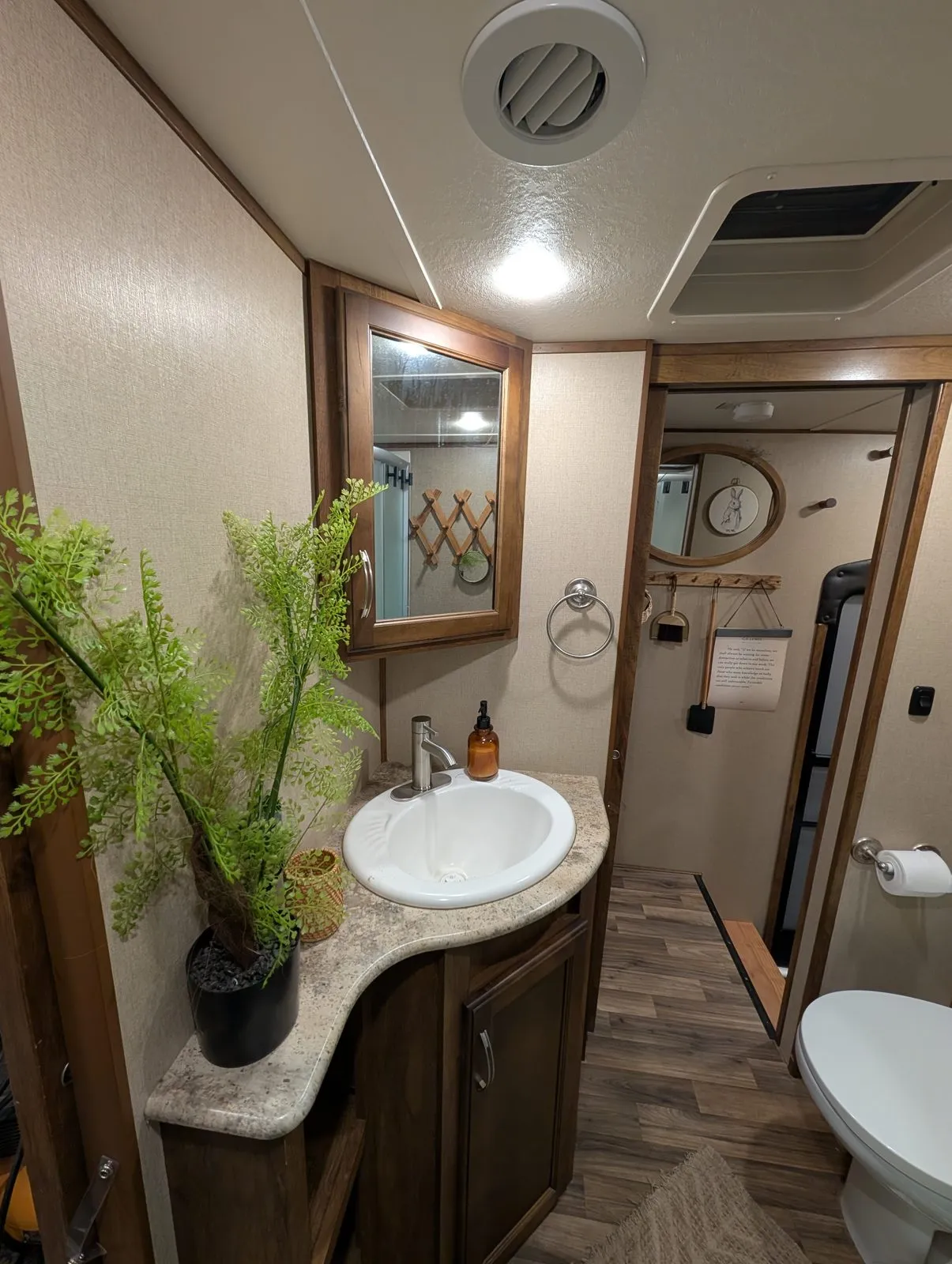 Inside the rental camper: the bathroom vanity with a sink and mirror
