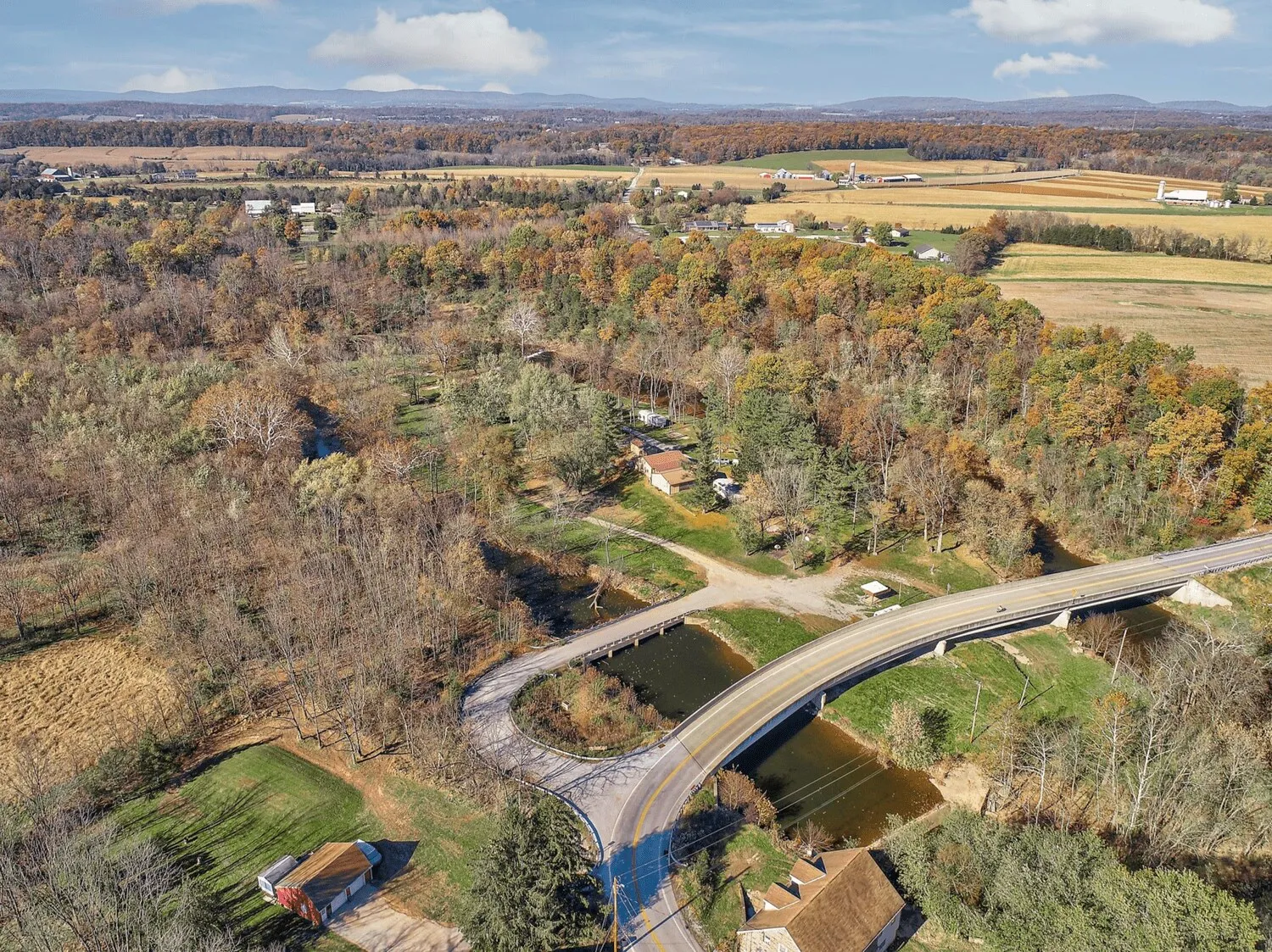 Aerial view of Campground Island and the bridge over Conewago Creek in autumn