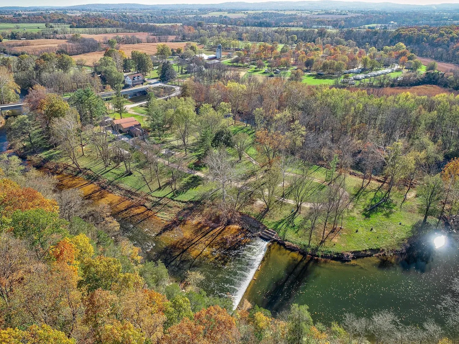 Aerial view of the island with Conewago Creek curving around it in autumn